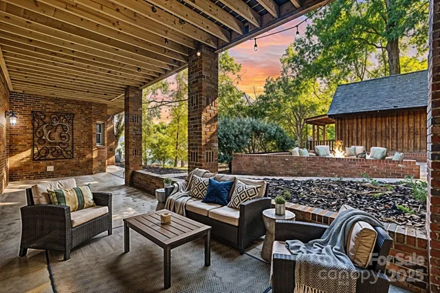 a outdoor living space with furniture and a rug