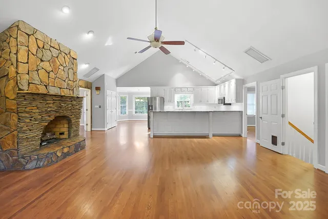 a view of a kitchen with furniture and a fireplace
