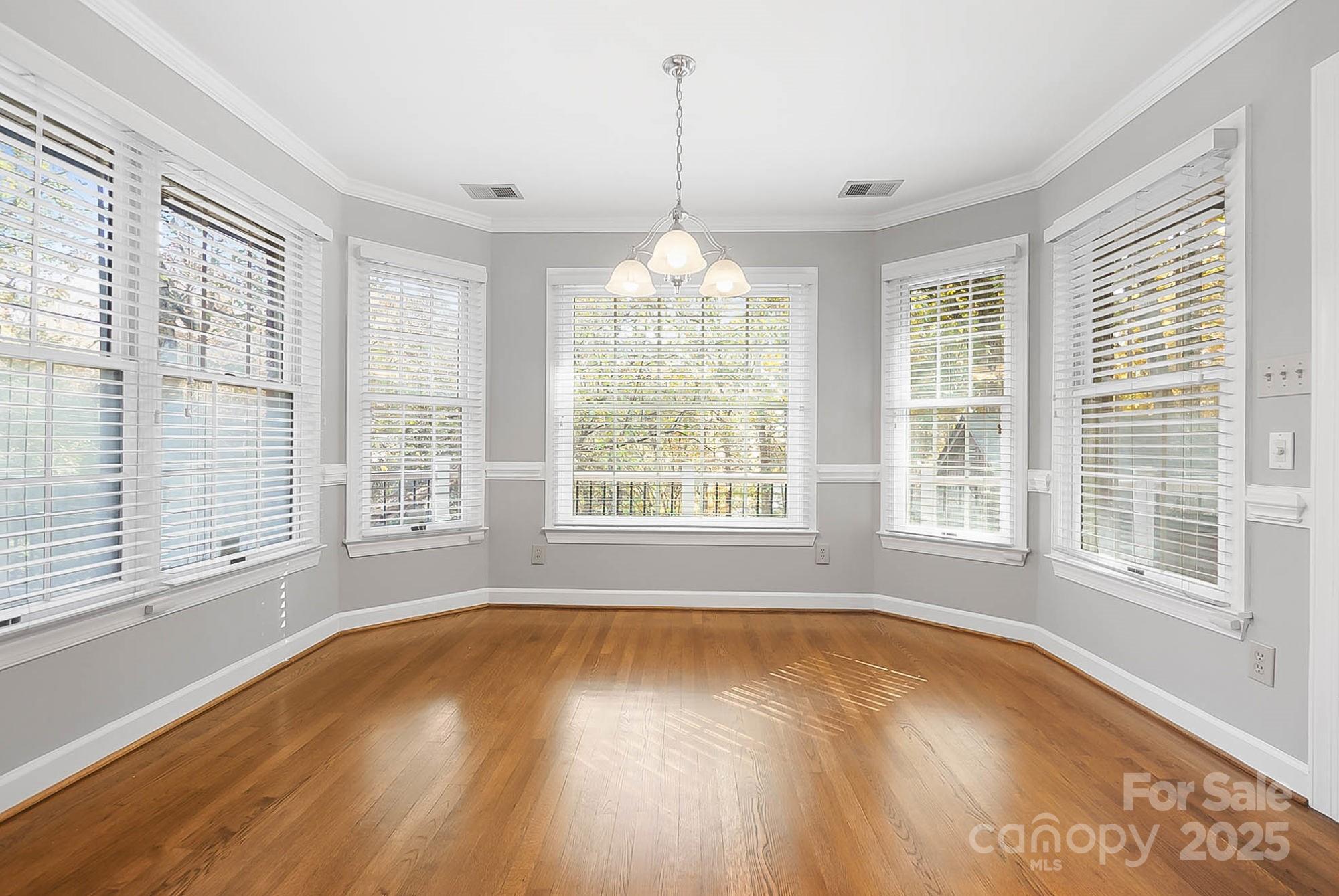 3475 Pikeview Road Fort Mill, SC 29715 - Photo 8 of 48 a view of an empty room with a window and wooden floor