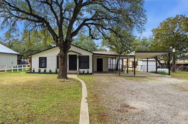 front view of a house with a yard