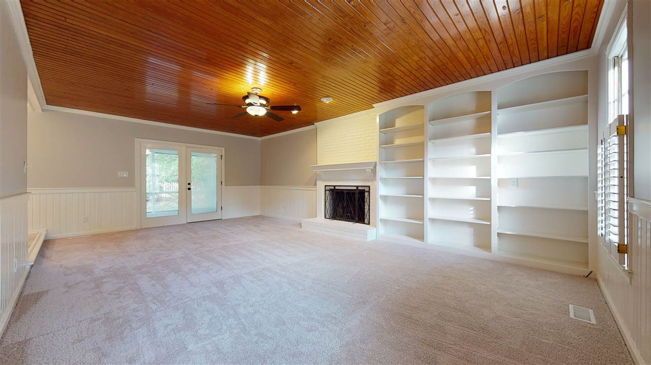 2604 Cobworth Court Raleigh, NC 27613 - Photo 4 of 30 Your family will love spending time together in this beautiful room accented with tongue & groove ceiling, masonry fireplace and custom built bookcases. Family Room