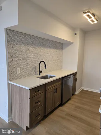 a kitchen with cabinets a sink and dishwasher