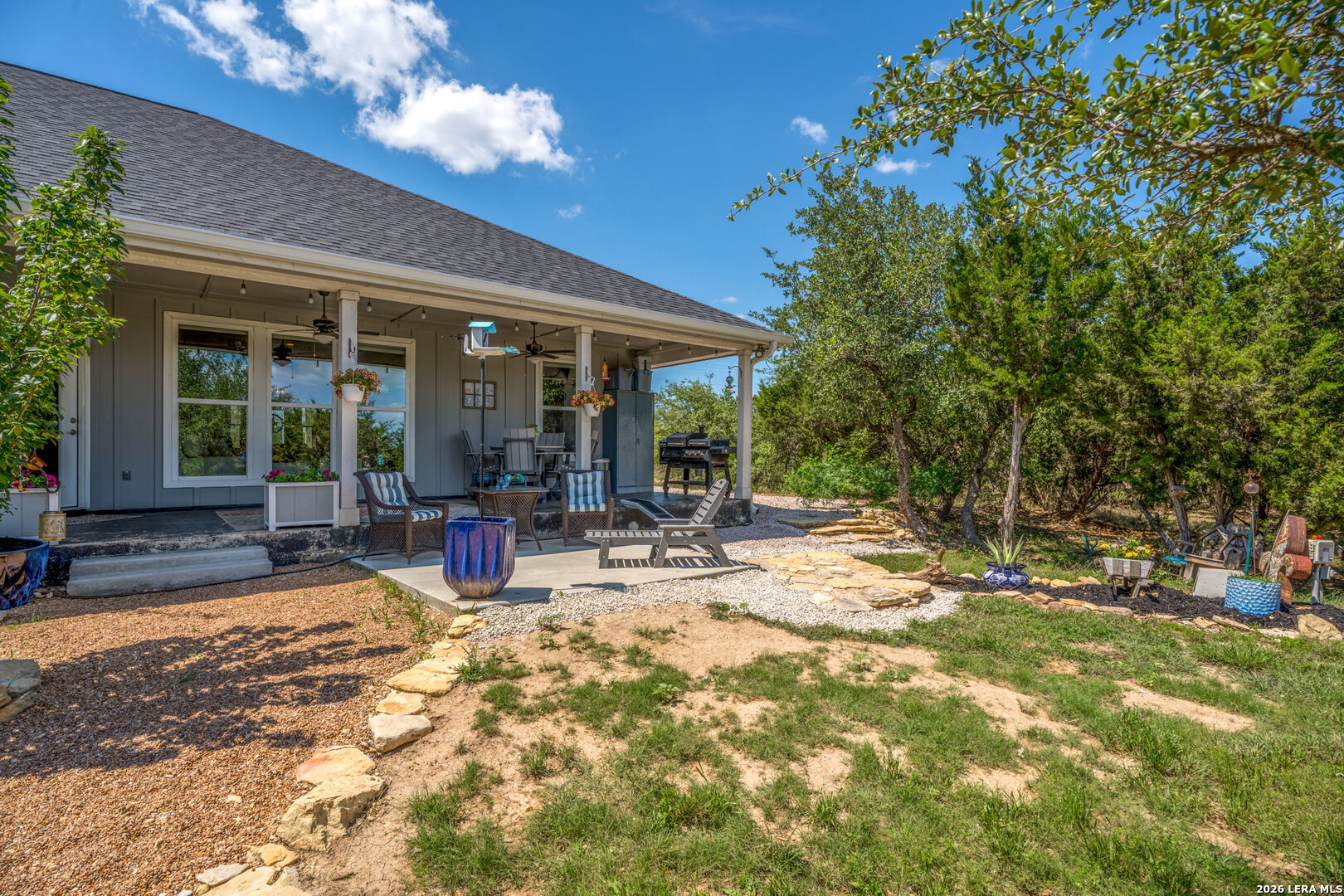 819 Primrose Path Spring Branch, TX 78070 - Photo 15 of 17 a view of a house with backyard porch and sitting area