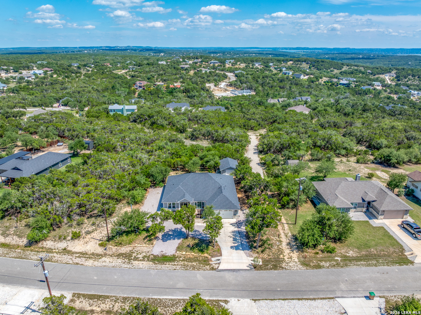 819 Primrose Path Spring Branch, TX 78070 - Photo 16 of 17 an aerial view of residential houses with outdoor space and trees