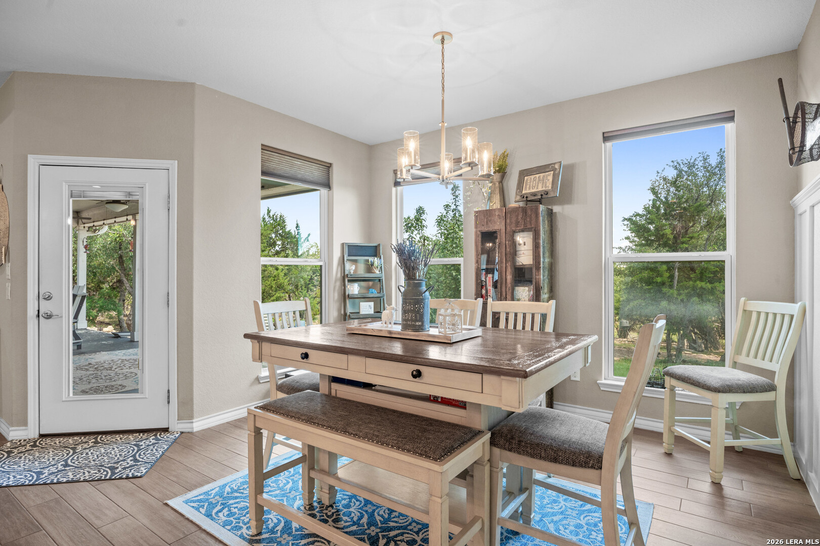 819 Primrose Path Spring Branch, TX 78070 - Photo 5 of 17 a living room with furniture and a chandelier