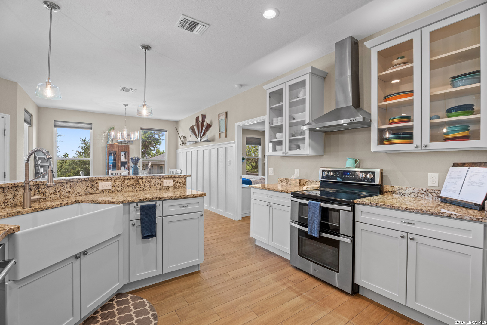 819 Primrose Path Spring Branch, TX 78070 - Photo 6 of 17 a kitchen with stainless steel appliances granite countertop a stove and cabinets