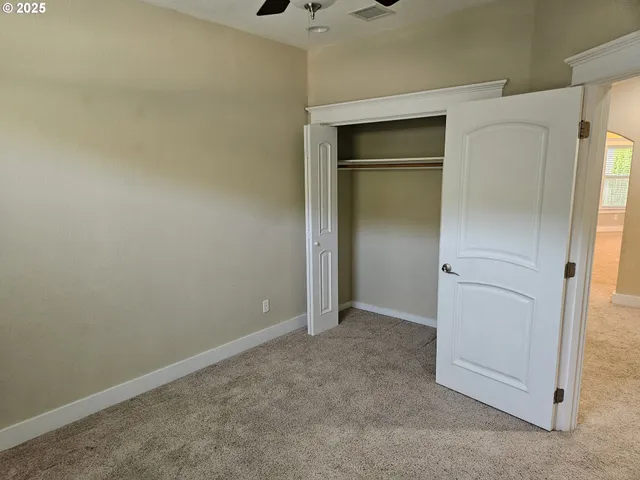 an empty room with a empty space and windows