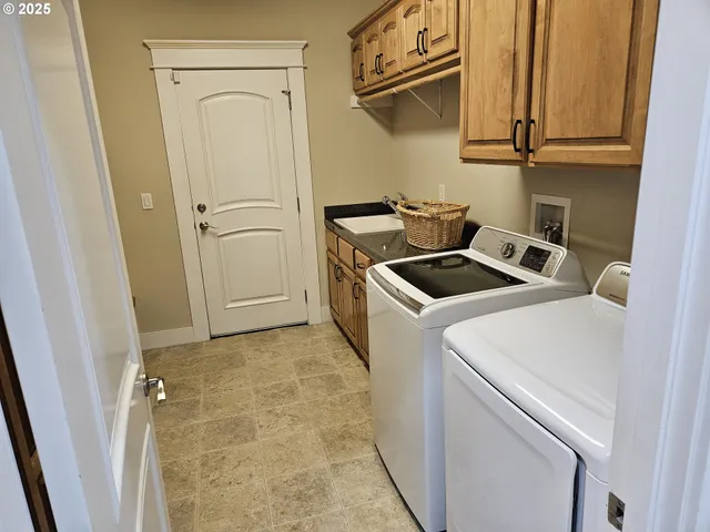 a kitchen with a refrigerator and a window