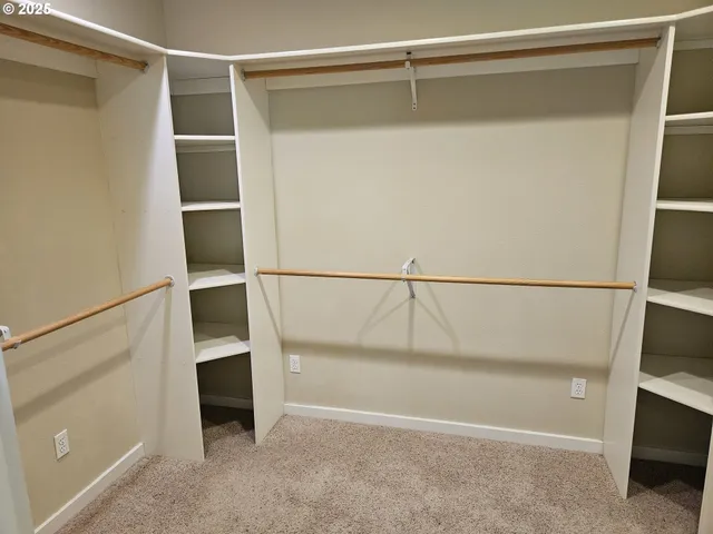 a view of an empty walk in closet