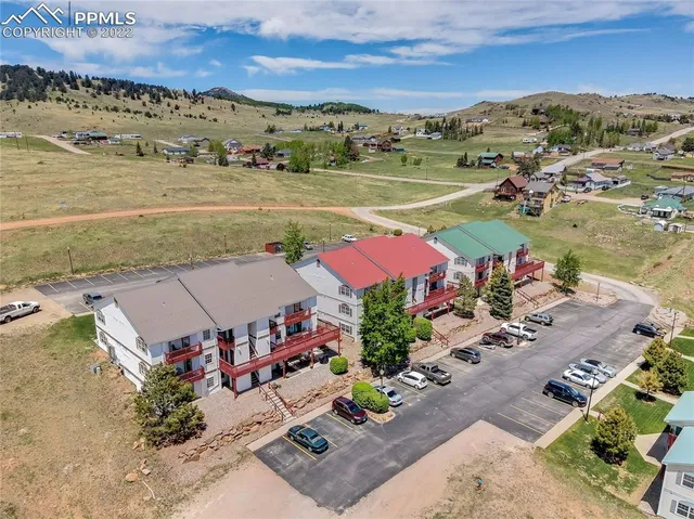 an aerial view of a houses with a lake view