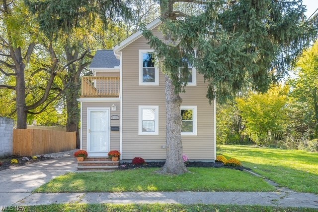 7214 Ottawa Road Cleveland, OH 44105 - Photo 2 of 25 View of front of home featuring a front lawn and a balcony