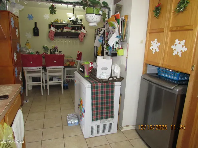 a dining room with furniture and a window