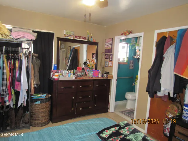 a bathroom with a sink mirror and toilet
