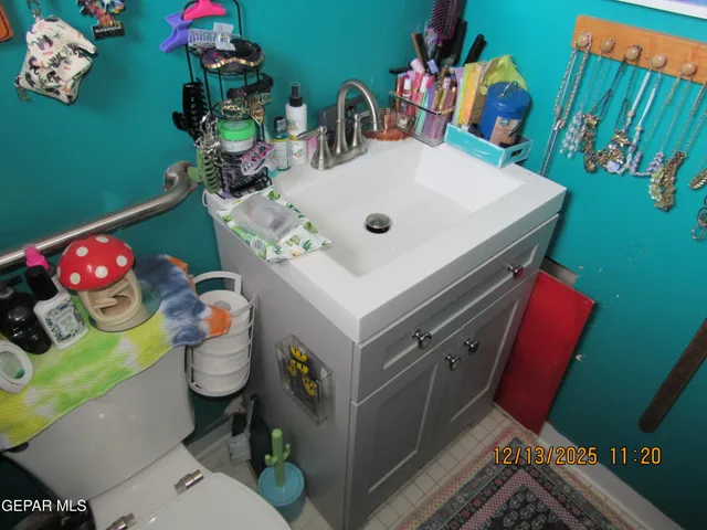 a bedroom with a bed a window and dresser