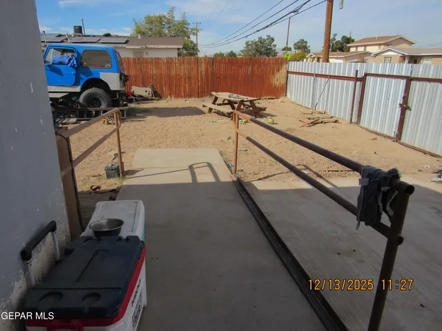 a view of a backyard with sitting area