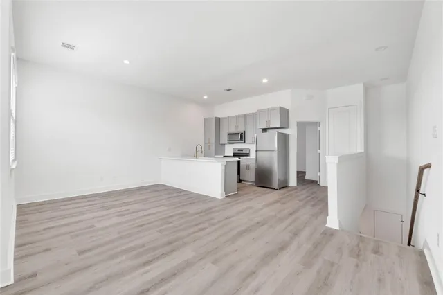 a kitchen with a sink and a window