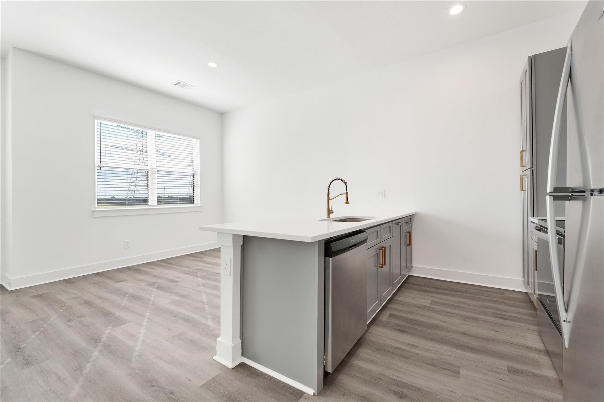 3210 Frying Pan Place, Unit B Katy, TX 77449 - Photo 13 of 49 a kitchen with a white stove top oven and refrigerator