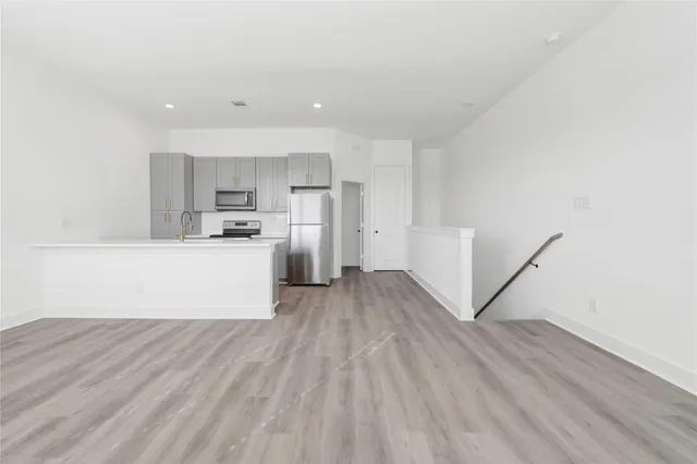 an empty room with wooden floor