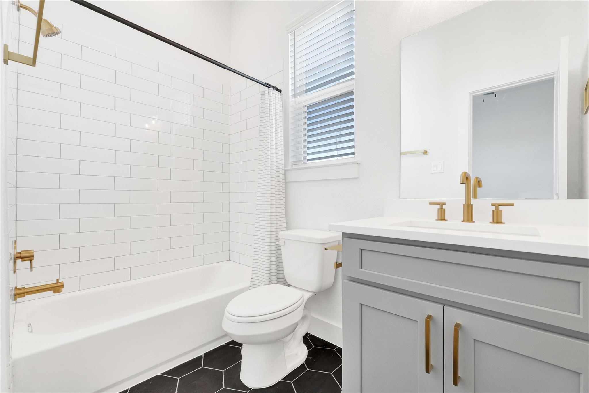 3210 Frying Pan Place, Unit B Katy, TX 77449 - Photo 35 of 49 a bathroom with a sink a toilet and a bathtub