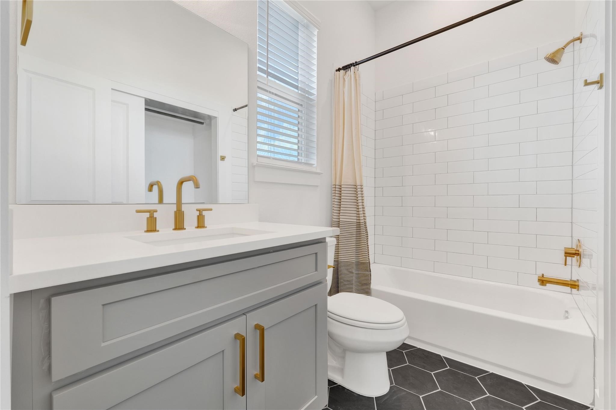 3210 Frying Pan Place, Unit B Katy, TX 77449 - Photo 36 of 49 a bathroom with a sink a toilet and a bathtub