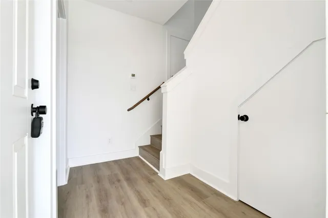 a kitchen with a white stove top oven and refrigerator
