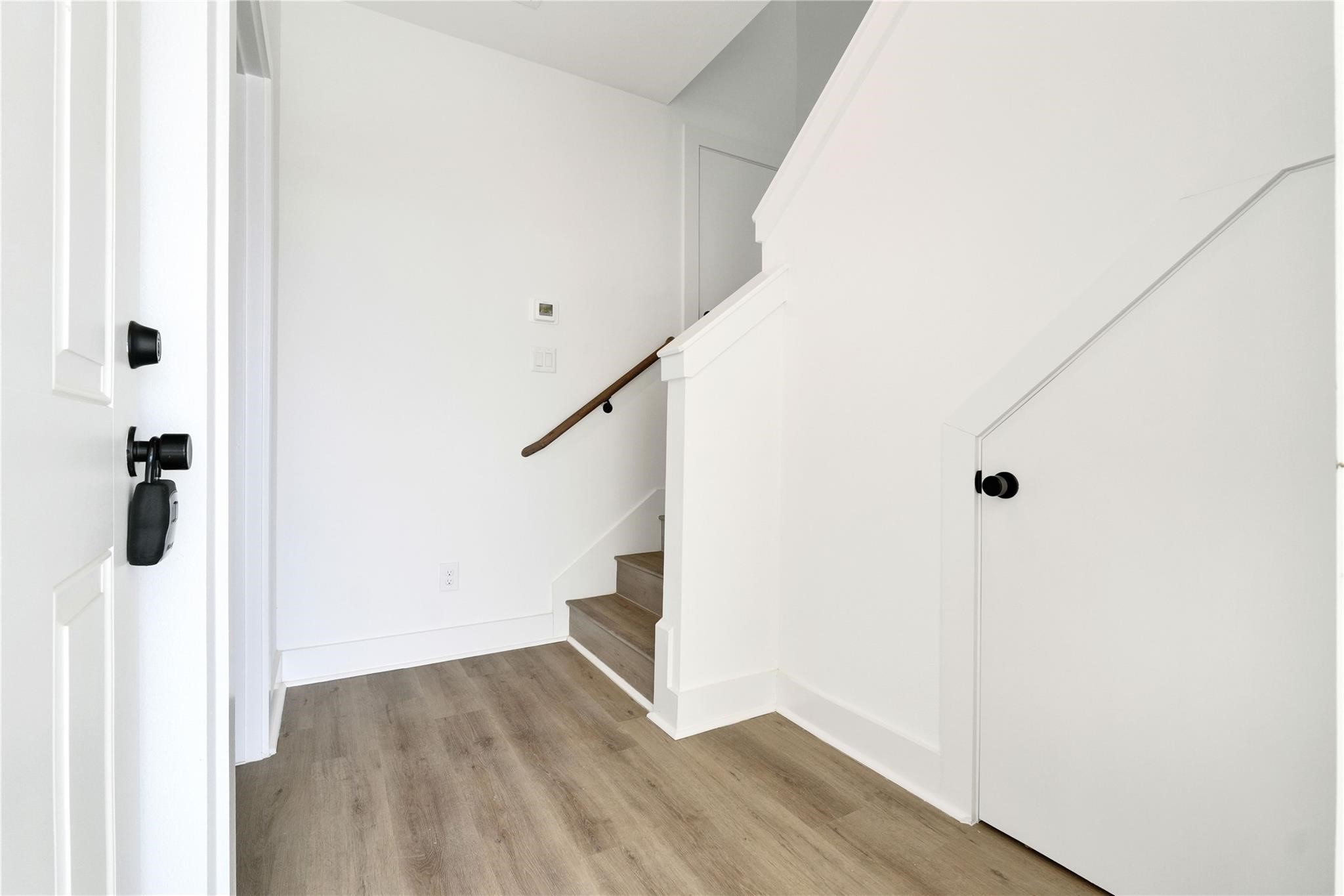 3210 Frying Pan Place, Unit B Katy, TX 77449 - Photo 7 of 49 a view of a hallway view with hardwood floor