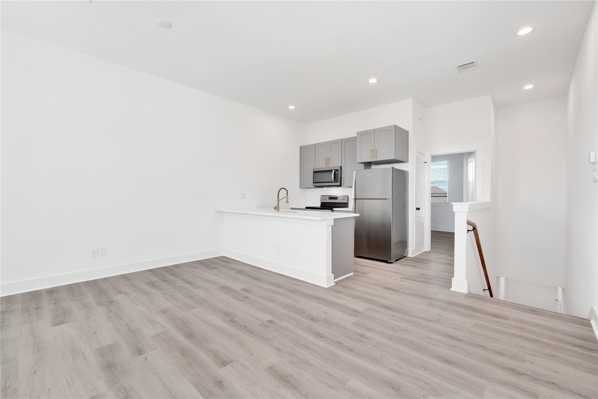 3210 Frying Pan Place, Unit B Katy, TX 77449 - Photo 9 of 49 a view of kitchen with wooden floor