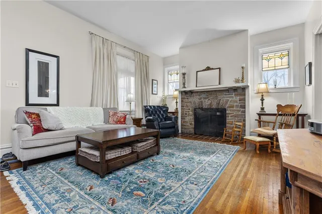 a living room with furniture and a fireplace