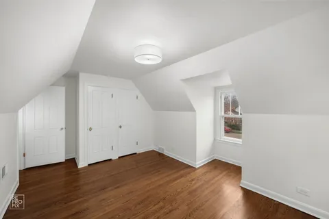 a view of room with hardwood floor and window