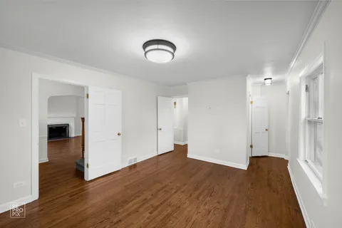 a bathroom with a sink toilet double vanity and shower