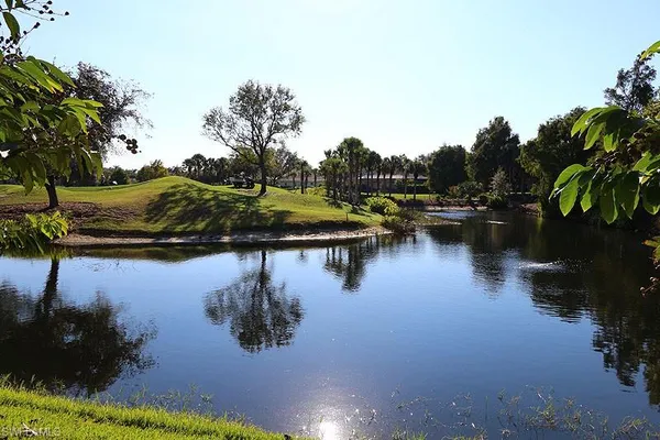 a view of swimming pool with outdoor seating and a patio