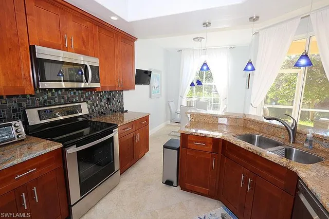 a kitchen with a stove and a sink