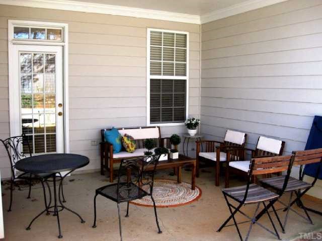 10463 Dapping Drive Raleigh, NC 27614 - Photo 11 of 12 a backyard of a house with table and chairs