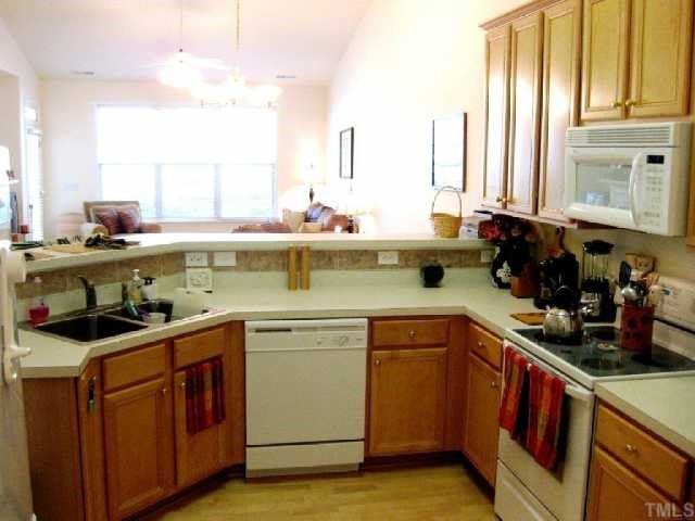10463 Dapping Drive Raleigh, NC 27614 - Photo 3 of 12 a kitchen with a sink stove and cabinets