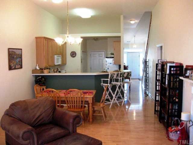 10463 Dapping Drive Raleigh, NC 27614 - Photo 8 of 12 a view of a dining room with furniture and wooden floor