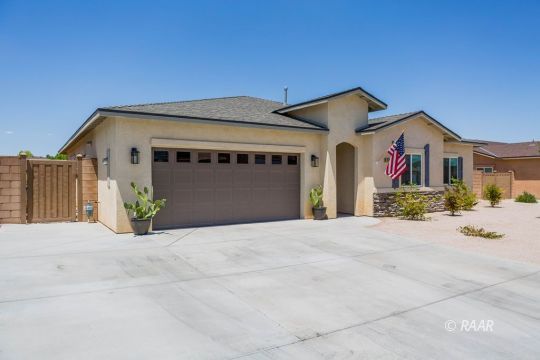 419 Abigail Street Ridgecrest, CA 93555 - Photo 4 of 34 a front view of a house with a garage
