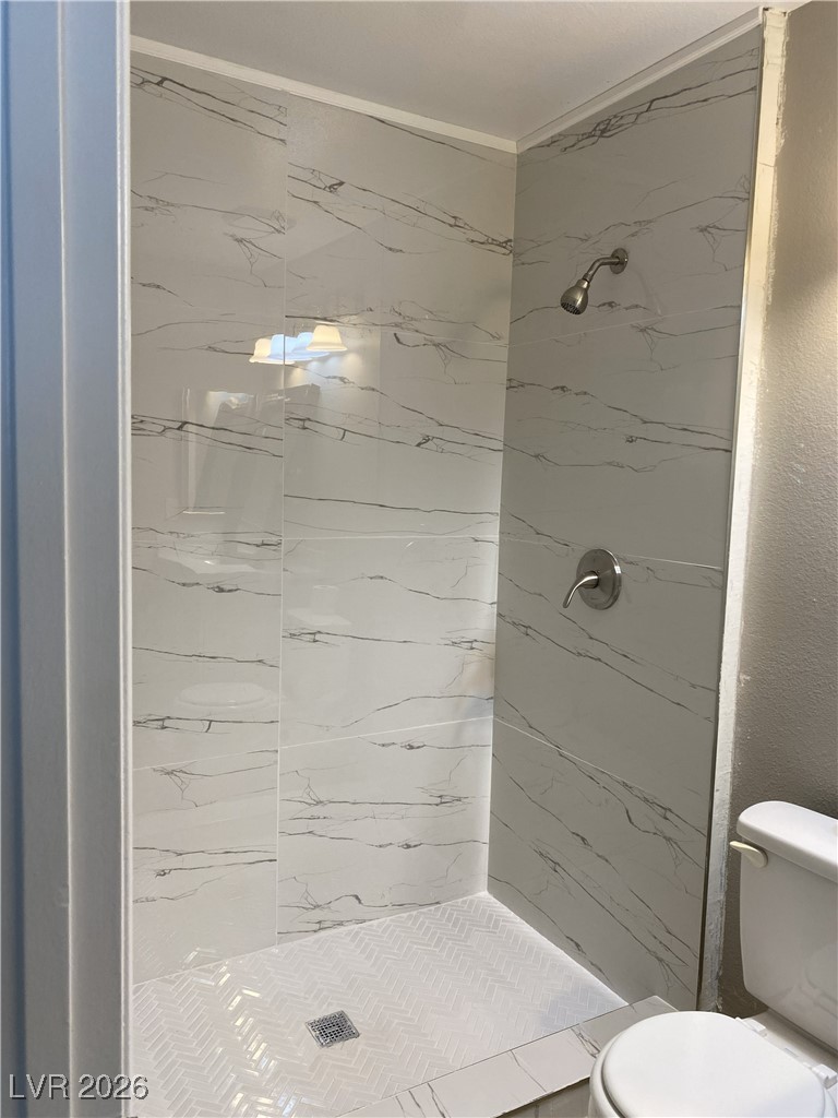 Undisclosed Address Las Vegas, NV 89108 - Photo 11 of 26 Bathroom featuring a stall shower and a textured wall