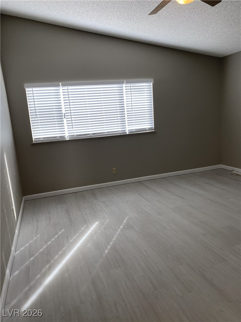 Undisclosed Address Las Vegas, NV 89108 - Photo 17 of 26 Spare room with a textured ceiling and a ceiling fan