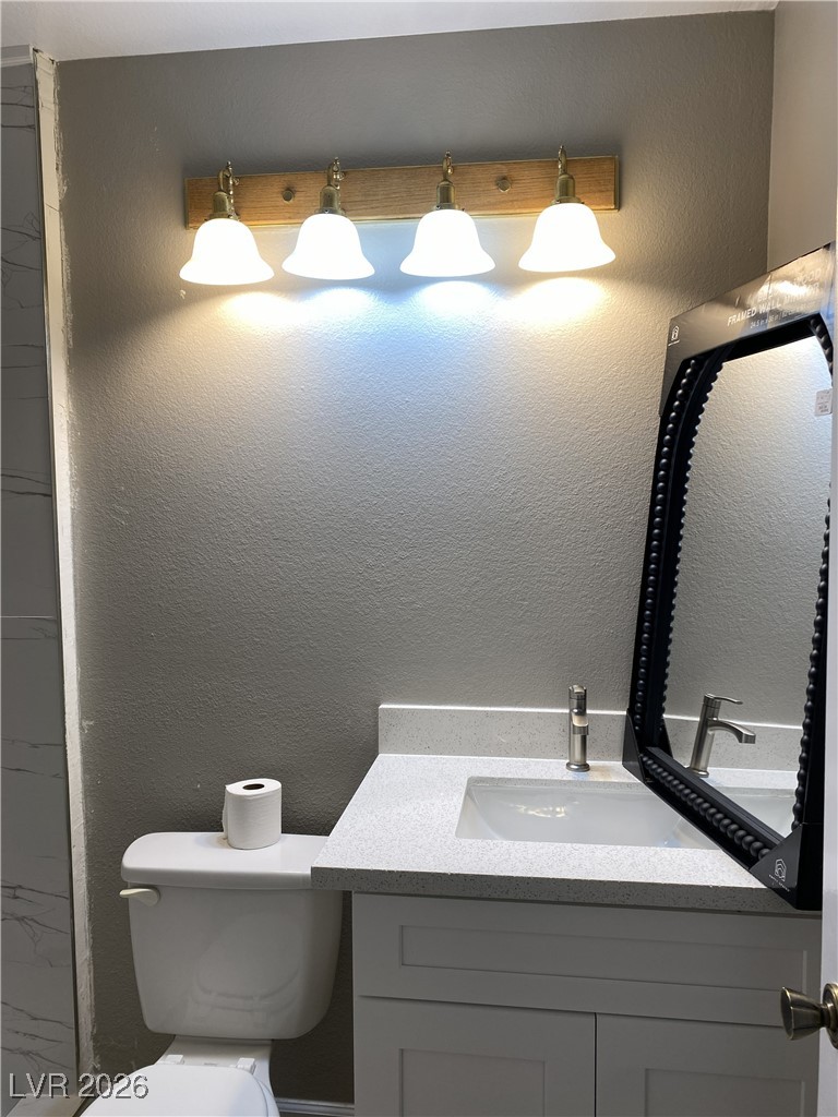 Undisclosed Address Las Vegas, NV 89108 - Photo 20 of 26 Bathroom with vanity and a textured wall