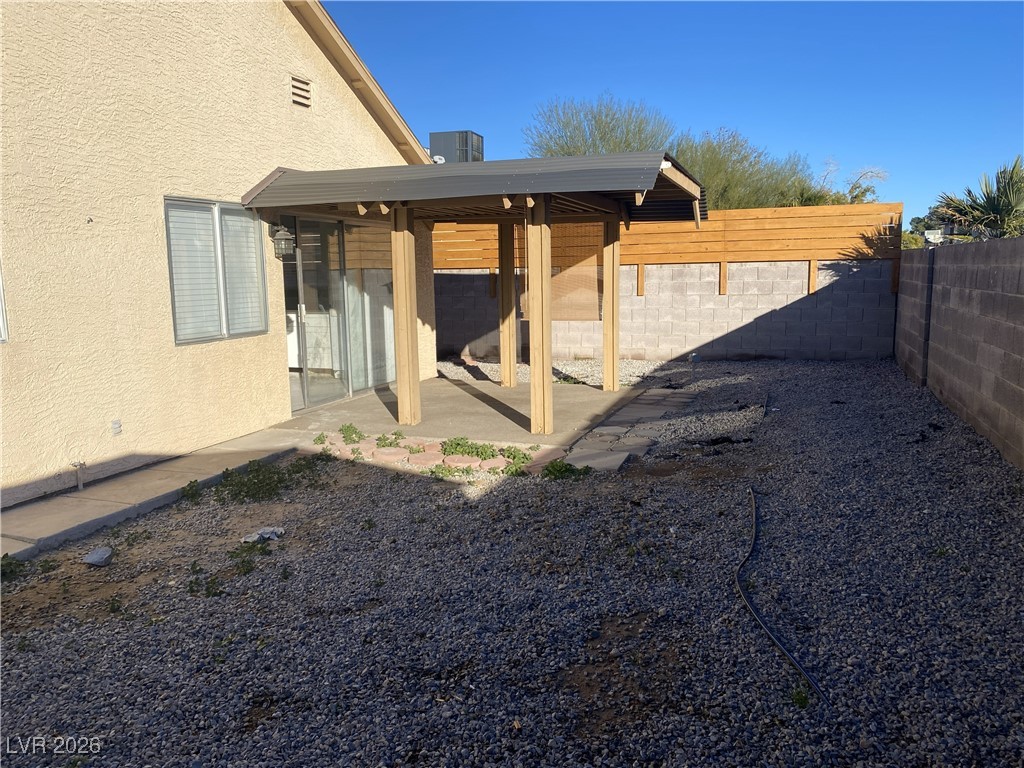 Undisclosed Address Las Vegas, NV 89108 - Photo 26 of 26 Fenced backyard with a patio area