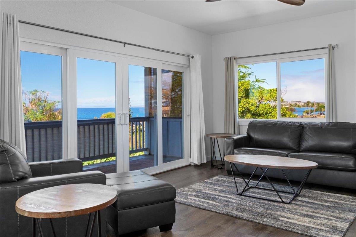 127 Wahikuli Road Lahaina, HI 96761 - Photo 12 of 27 a living room with furniture and a potted plant