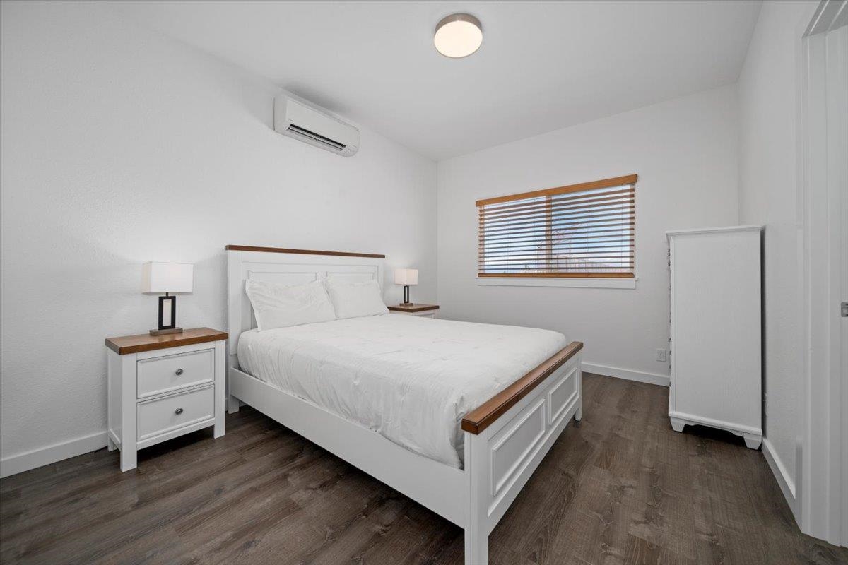 127 Wahikuli Road Lahaina, HI 96761 - Photo 14 of 27 a bed room with a bed and a night stand