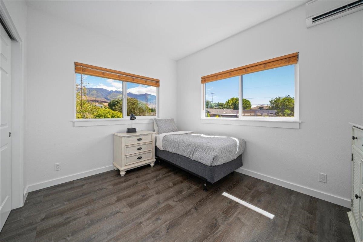 127 Wahikuli Road Lahaina, HI 96761 - Photo 18 of 27 a bedroom with a bed and a window