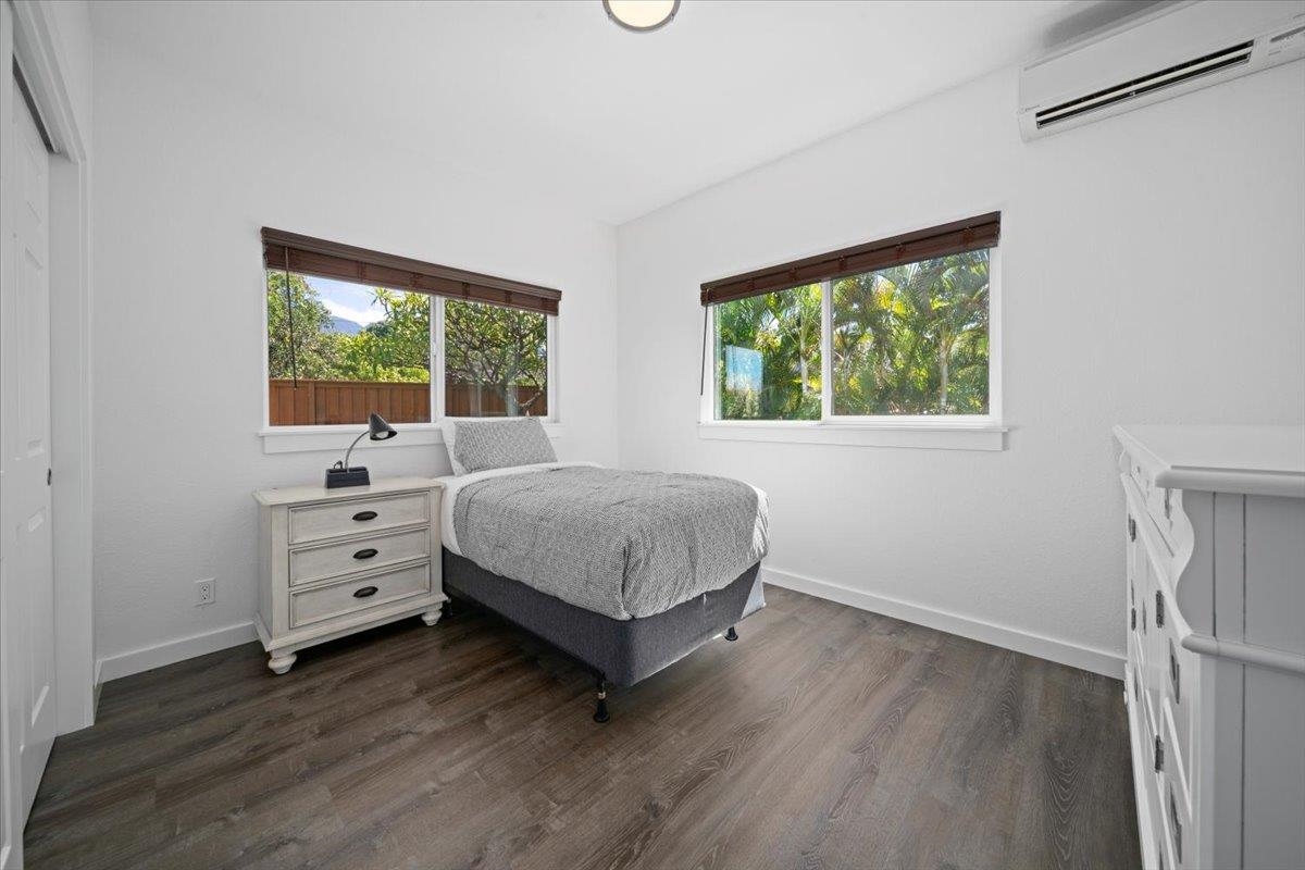 127 Wahikuli Road Lahaina, HI 96761 - Photo 20 of 27 a bedroom with a bed and a window