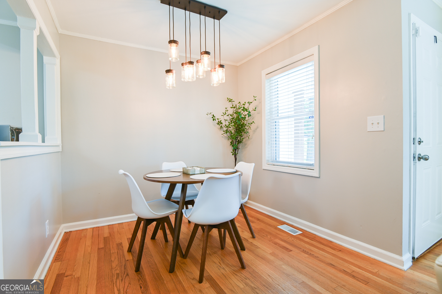 545 Forest Hill Road Macon, GA 31210 - Photo 28 of 63 a view of a dining room with furniture wooden floor and chandelier
