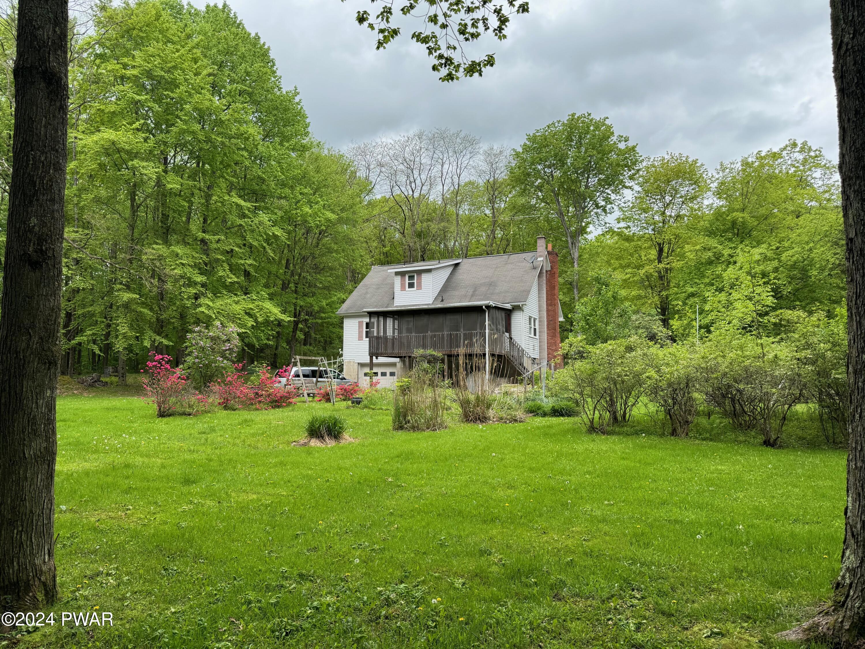 359 Canaan Road Waymart, PA 18472 - Photo 8 of 32 a view of a house with garden
