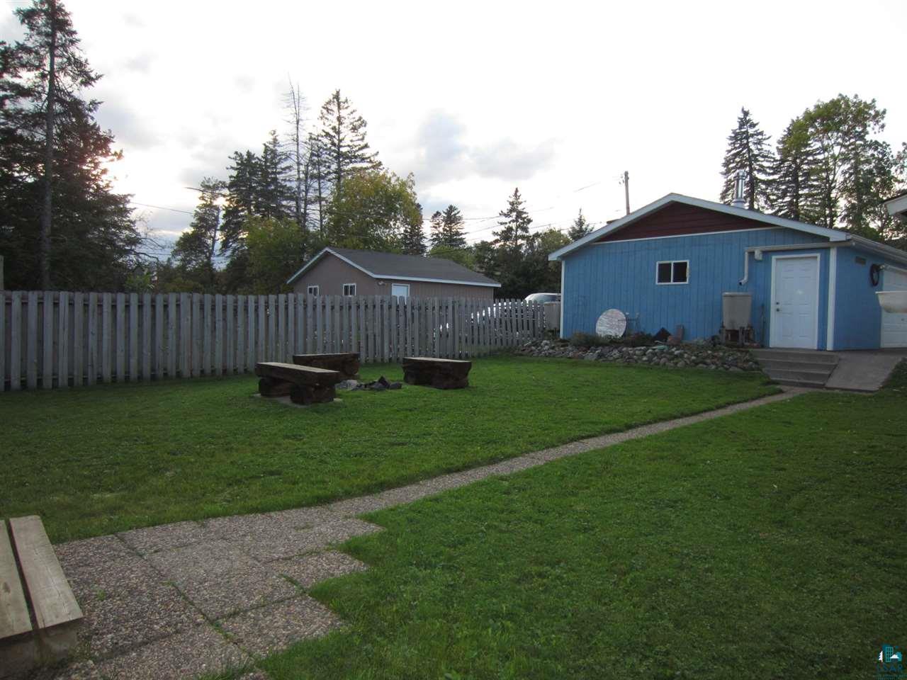 5137 London Road Duluth, MN 55804 - Photo 18 of 20 features a firepit and fenced back yard.