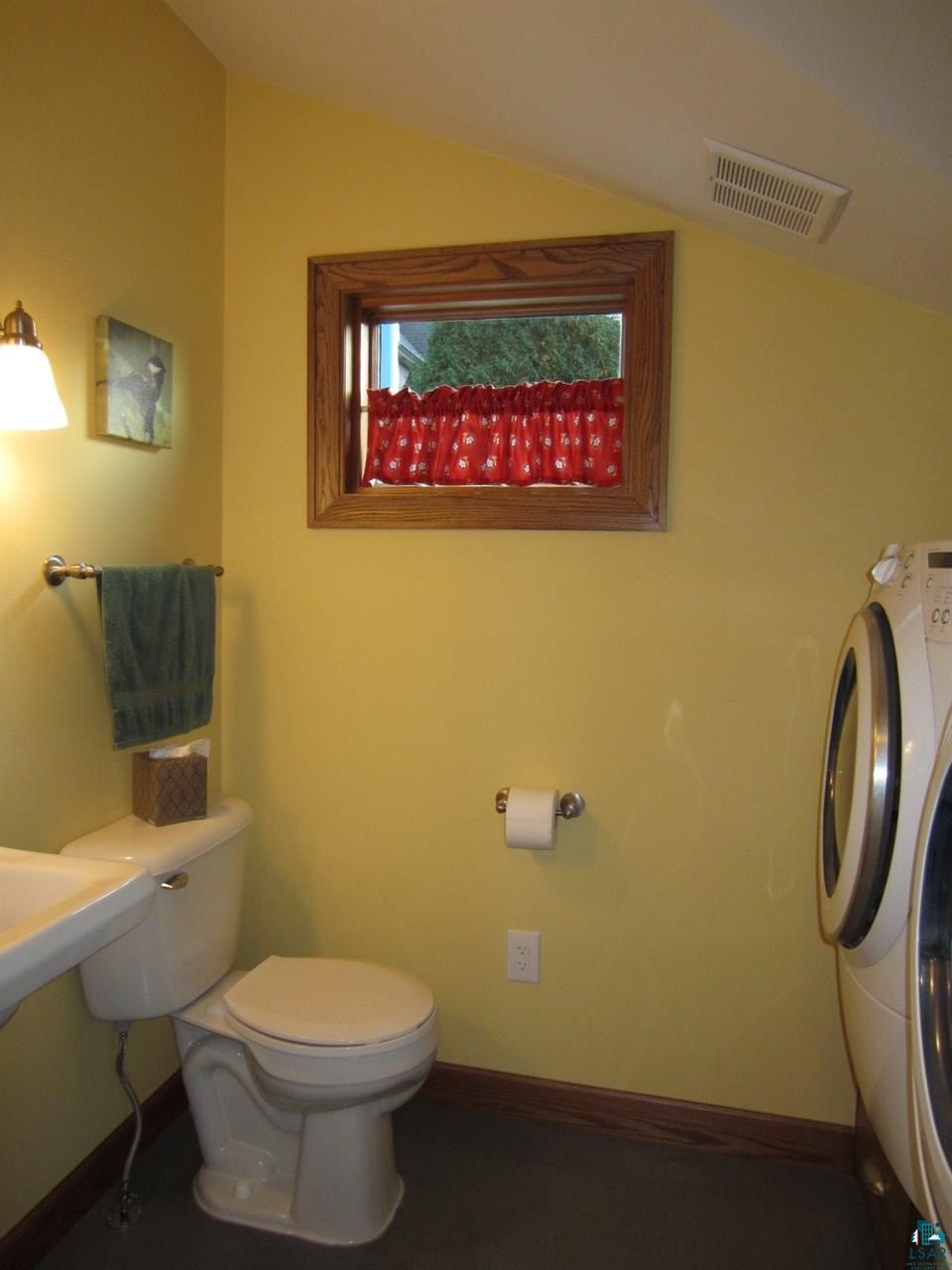 5137 London Road Duluth, MN 55804 - Photo 8 of 20 half bath and main floor laundry room