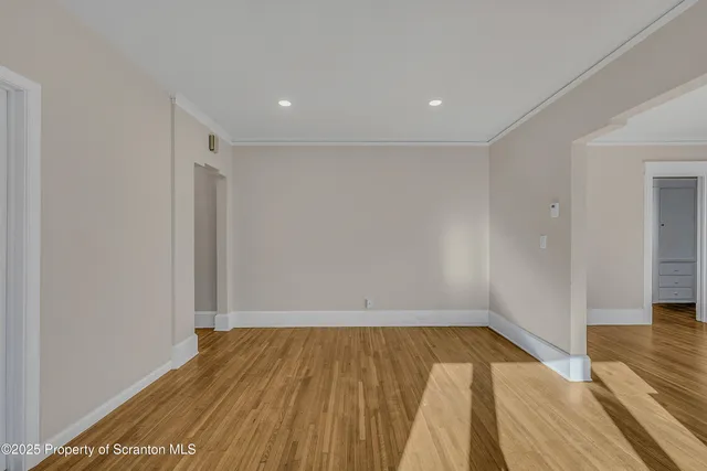 a view of wooden floor and brick walls