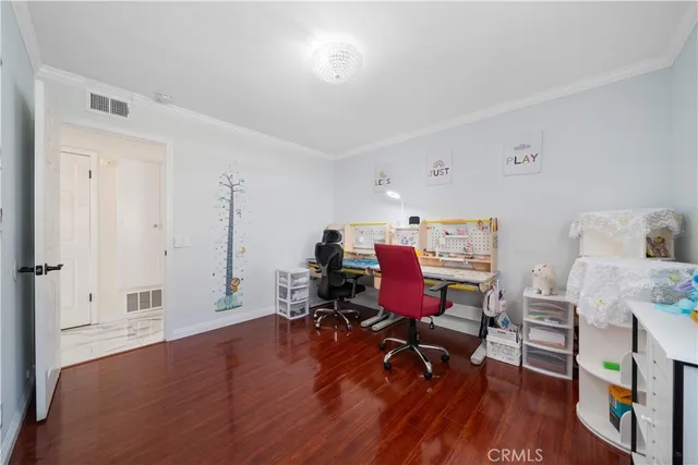a workspace with furniture and wooden floor